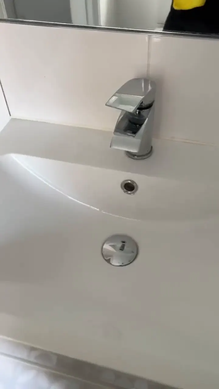 The same chrome basin tap and plug after cleaning