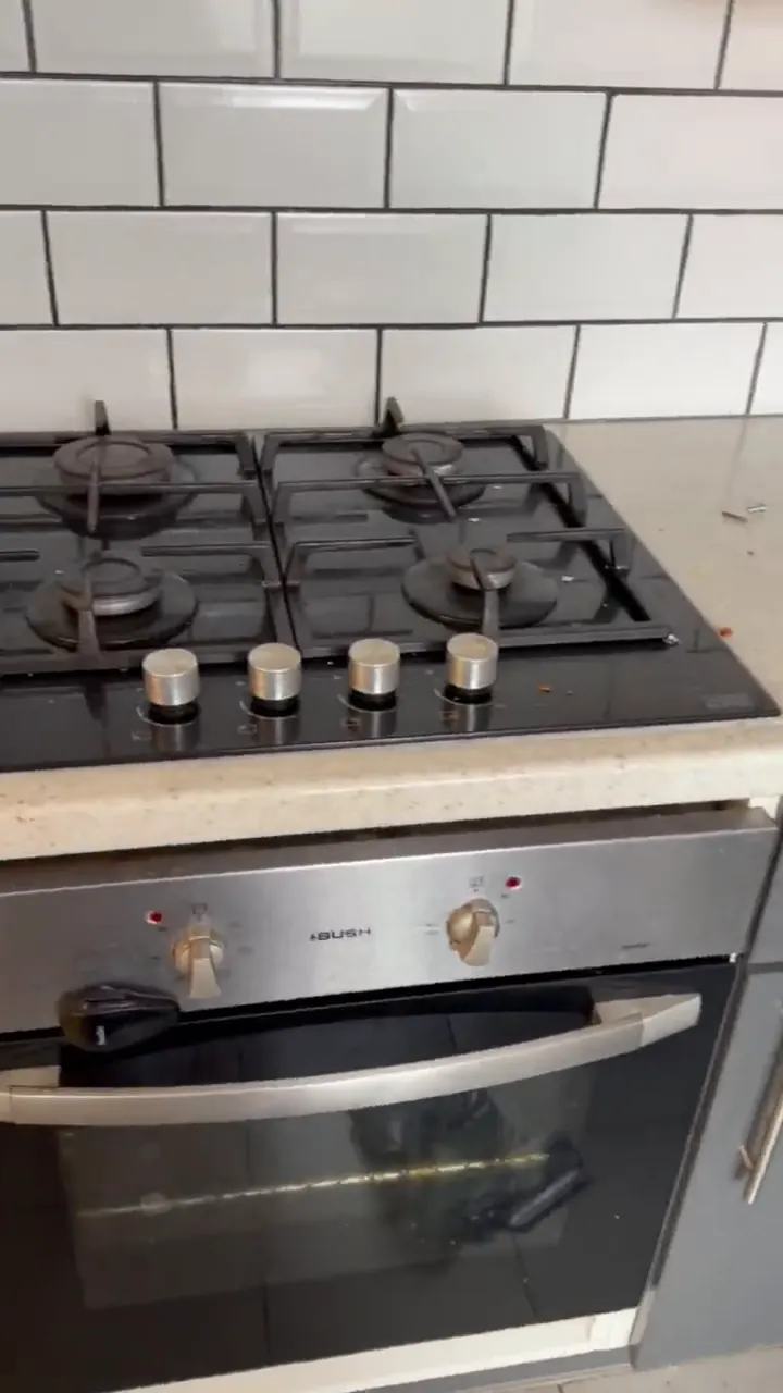 Kitchen worktop, gas hob and floor with debris left behind